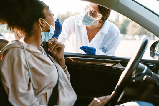 Health Worker In Gloves Making Covid Test To Black Woman