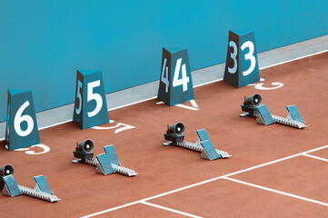 On starting block ready for sprint start. Professional sport concept. Horizontal sport poster,...