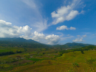 Fototapeta na wymiar Photos of mountain views, rice fields and fields in the Cicalengka area from the top of the hill