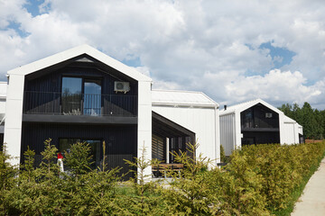 Fototapeta premium Background image of houses designed with minimal Scandinavian aesthetic in black and white colors, copy space