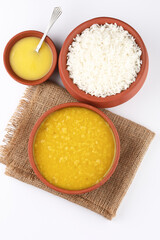 Indian staple food everyday meal Dal Rice or yellow lentil soup with white rice and ghee also called dal chaval & varan bhat