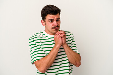 Young caucasian man isolated on white background scared and afraid.