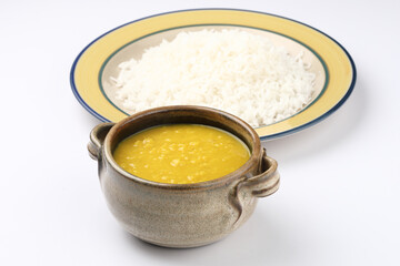 Indian staple food everyday meal Dal Rice or yellow lentil soup with white rice and ghee also called dal chaval & varan bhat