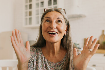 Cheerful elderly woman telling funny story from life. Excited female describe what happened. Remember warm memories from past. Bright emotion, happiness, quiet conversation on kitchen concept - obrazy, fototapety, plakaty
