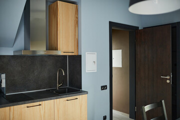 Background image of minimal house interior with focus on wooden kitchen countertops, copy space