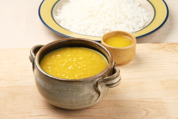 Indian staple food everyday meal Dal Rice or yellow lentil soup with white rice and ghee 