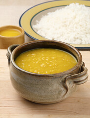 Indian staple food everyday meal Dal Rice or yellow lentil soup with white rice and ghee also called dal chaval & varan bhat