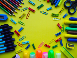 School office supplies on a yellow background. Preparation for school. Education concept.