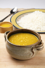 Indian staple food everyday meal Dal Rice or yellow lentil soup with white rice and ghee also called dal chaval & varan bhat