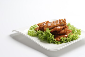 deep fried pork chop with chef special mayonnaise sauce in white black background dim sum snack halal menu