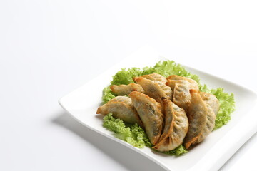 deep fried pork dumpling guo tie jiaozi dim sum in white black background dim sum snack halal menu