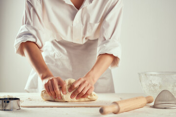 Obraz na płótnie Canvas kitchen chef kneading dough professional homework baking