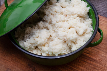 Traditional African maize meal in rustic green pot