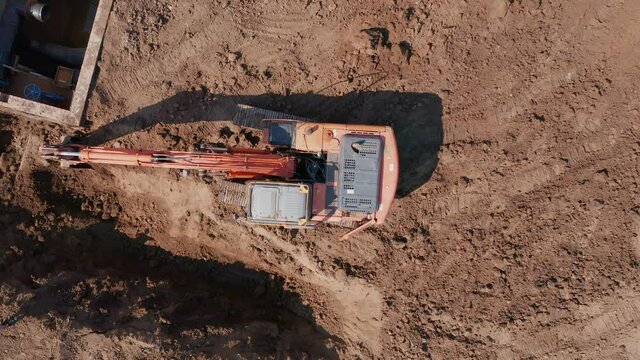 Soil storage during excavator operation. The technology of manufacturing a pit for laying the foundation. Building materials. Zoom in. High quality. 4k footage.
