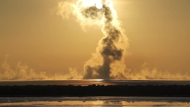 smoky hot mudflow in "Lapindo" Surabaya Indonesia