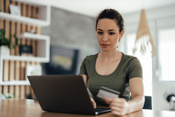 Young woman, ordering something online.