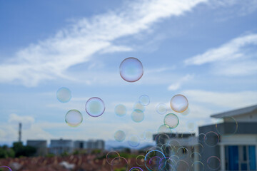 soap bubbles are floating with apartment background.