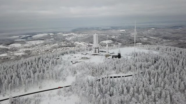 Dlog Drone view of the Feldberg Taunus Schmitten area during a cold winter day. Trees covered in snow and ice. Forrest in snow.