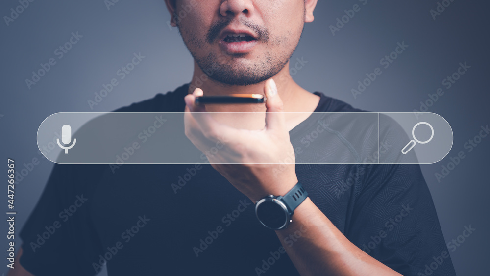 Fototapete Voice assistance for searching in smartphone. Man talking to smartphone for Searching for information. Using Search Console with your website. Data Search Technology Search Engine Optimization.
