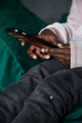 Young black girl's hands using a phone