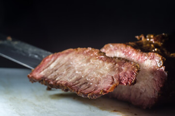 hump steak being sliced ​​with copy space