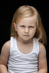 Naklejka premium Stubborn kid being in bad mood and frowning