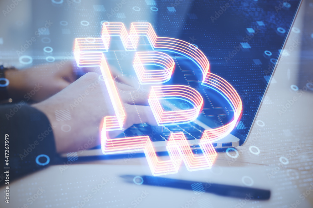 Poster Close up of hands using laptop at desktop with creative glowing bitcoin icon on blurry blue background with circles. Digital banking and cryptocurrency concept. Double exposure.