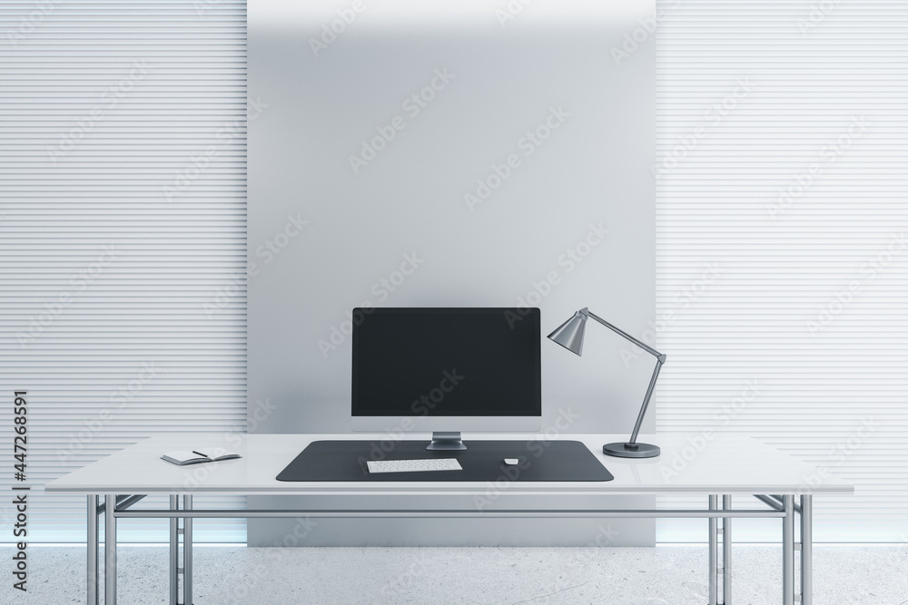 Poster Desk with empty black computer screen in modern white office interior with daylight. Mock up, 3D Rendering.
