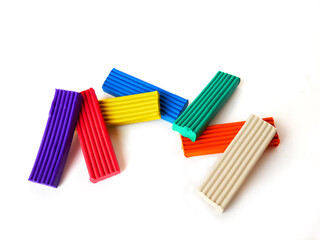 Fototapeta premium Plasticine bricks on a white background. Insulated plasticine briquettes for creative graphic layouts.