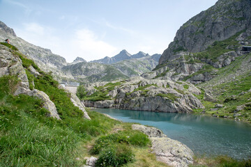 Fototapeta na wymiar Meadows, rivers, forest, lakes and mountains in the Aragonese Pyrenees bordering the French border