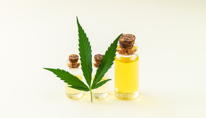 Banner of glass bottles of hemp oil and cannabis leaf