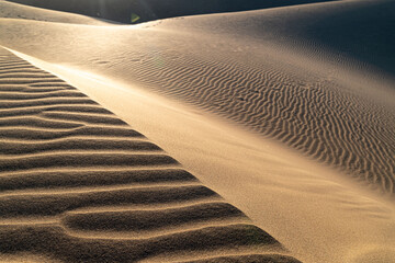 sun reflection on desert sand