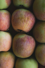 Ripe apples texture. Organic natural fruits background. Top view, flat lay, vertical