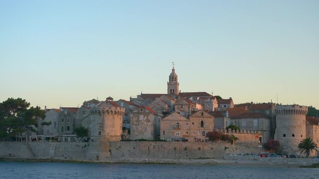 Picturesque view of the stunning medieval fort of Korcula island at sunrise. Spectacular vista of a historic fortress on the coast of a quiet island in the Mediterranean. Coastal stronghold at sunset.