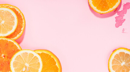 Summer vibe orange citrus slice fruit texture background on pastel pink with wet spots