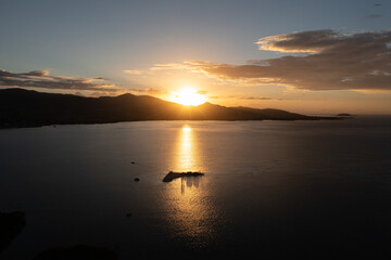 lake in front of the mountains at sunset