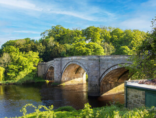 Fototapeta na wymiar Stone bridge at Piercebridge County Durham on the river Tees.