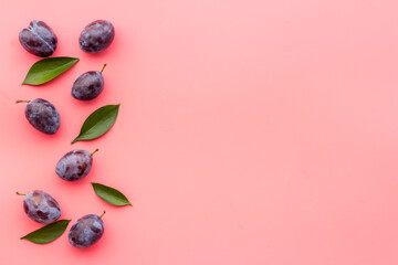 Purple cherry plums layout. Food fruits background. Top view