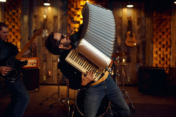 Two musicians with accordion and electric guitar - obrazy, fototapety, plakaty