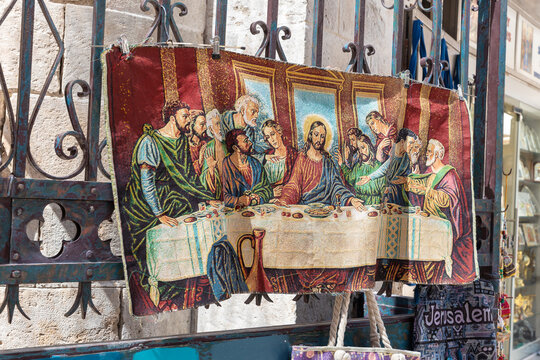 A carpet with a picture of the Last Supper on it hangs in a souvenir shop on Muristan street in the Christian quarter in the old city of Jerusalem, Israel