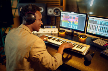 Male dj listening a record, recording studio