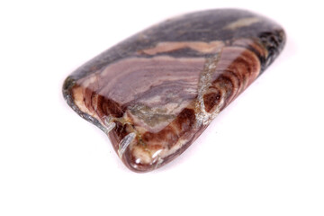 Macro mineral stone jasper on a white background