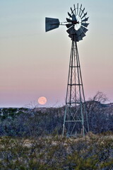 Windmill and moonset near Sanderson Texas