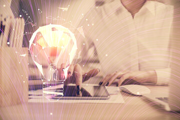 Double exposure of light bulb hologram and woman holding and using a mobile device. Idea concept.