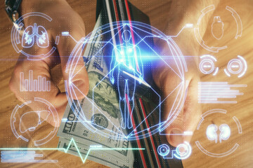 Multi exposure of education theme drawing hologram and USA dollars bills and man hands.