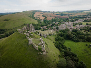 Aerial view of Corfe Cstle village and castle, an historic ruins near Swanage in Dorsets Jurassic Coast- UK 