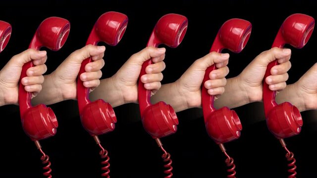 Hands holding red phones
