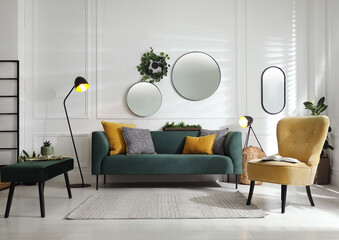 Modern living room interior with stylish comfortable sofa - obrazy, fototapety, plakaty