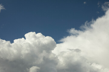 White clouds in the sky. Cumulus clouds against the blue sky.