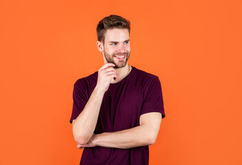 having pleasant smile. happy guy on orange background. cheerful man looking so trendy and stylish.